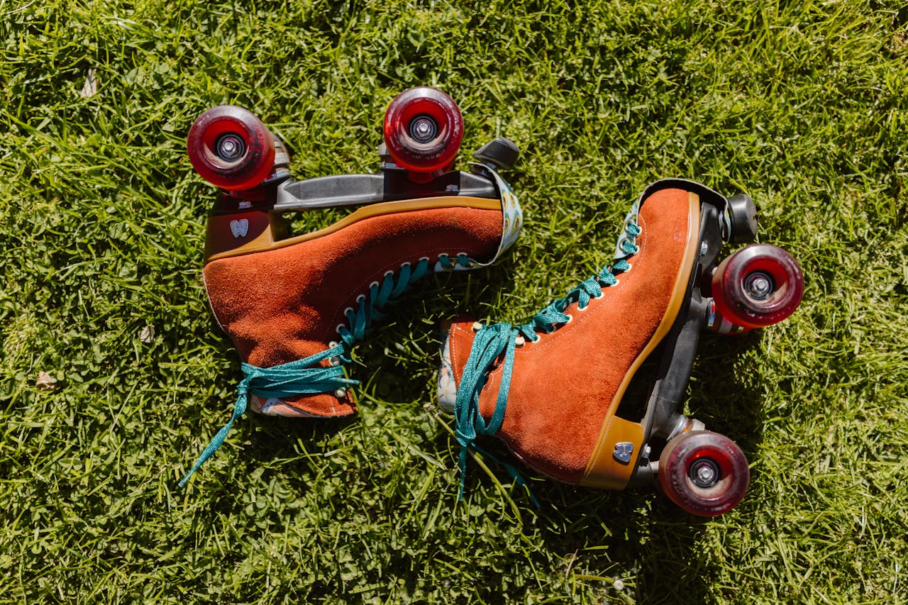 The Art of Drawing Readers In: Your attractive post title goes here Pair of retro roller skates with red wheels on bright green grass in daylight.